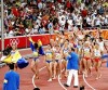 Mulheres dão a volta olímpica após heptatlo. (bryangeek/flickr)